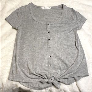 Grey deep u neck shirt with tie on the bottom